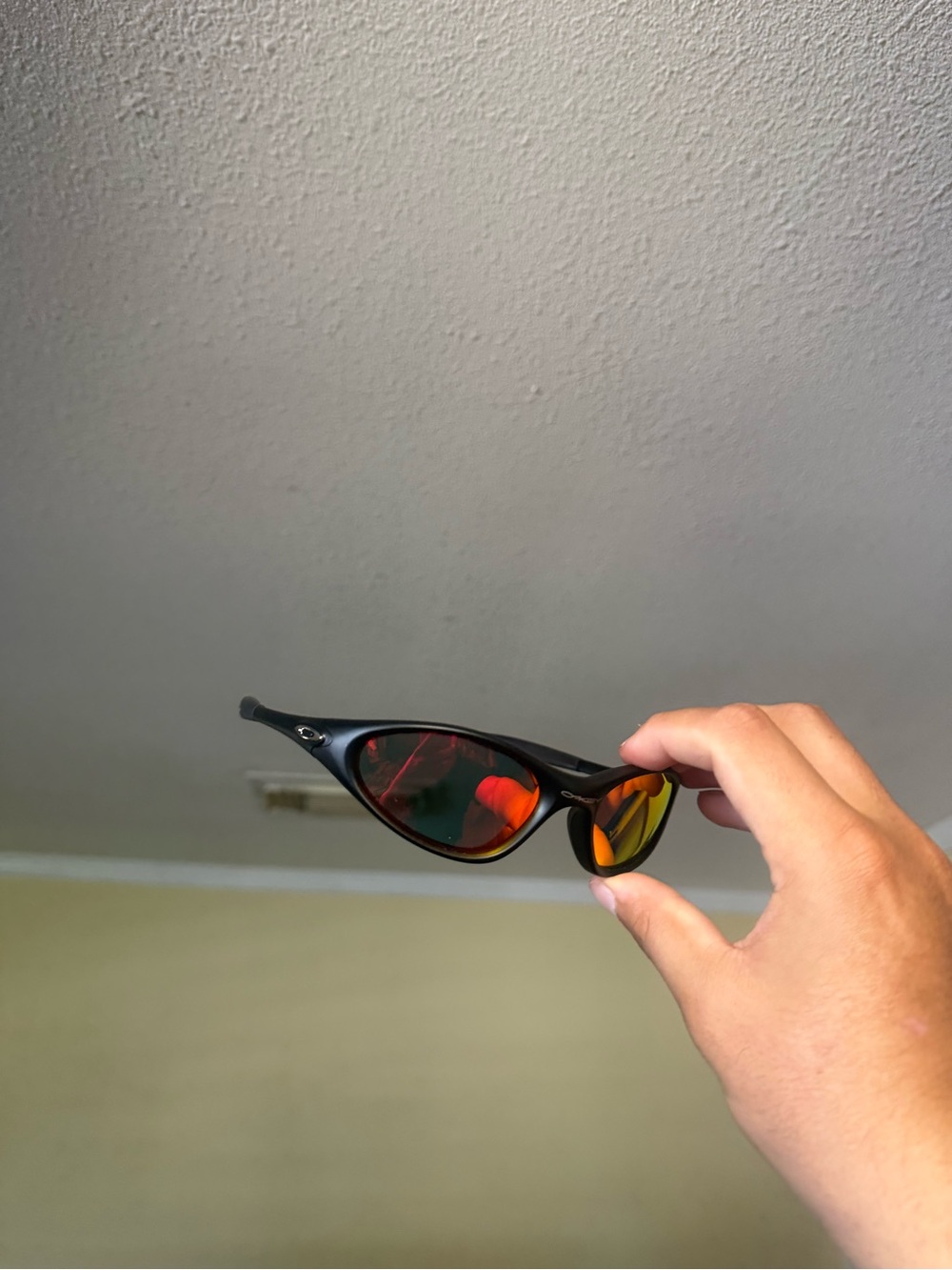 Oakley Men’s Black Frame Sunglasses with Red Mirrored Lenses